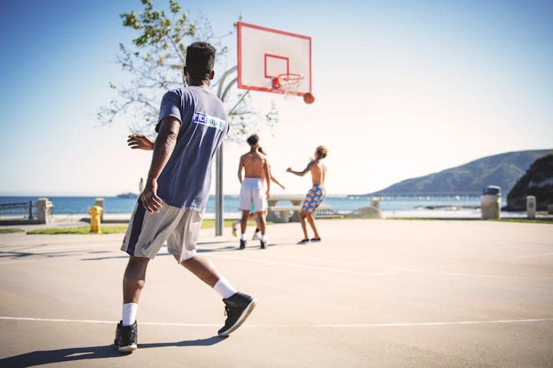 Basketball game action on an outdoor Vancouver court